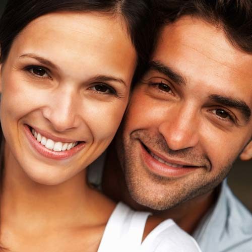 Smiling Couple with Dental Crowns